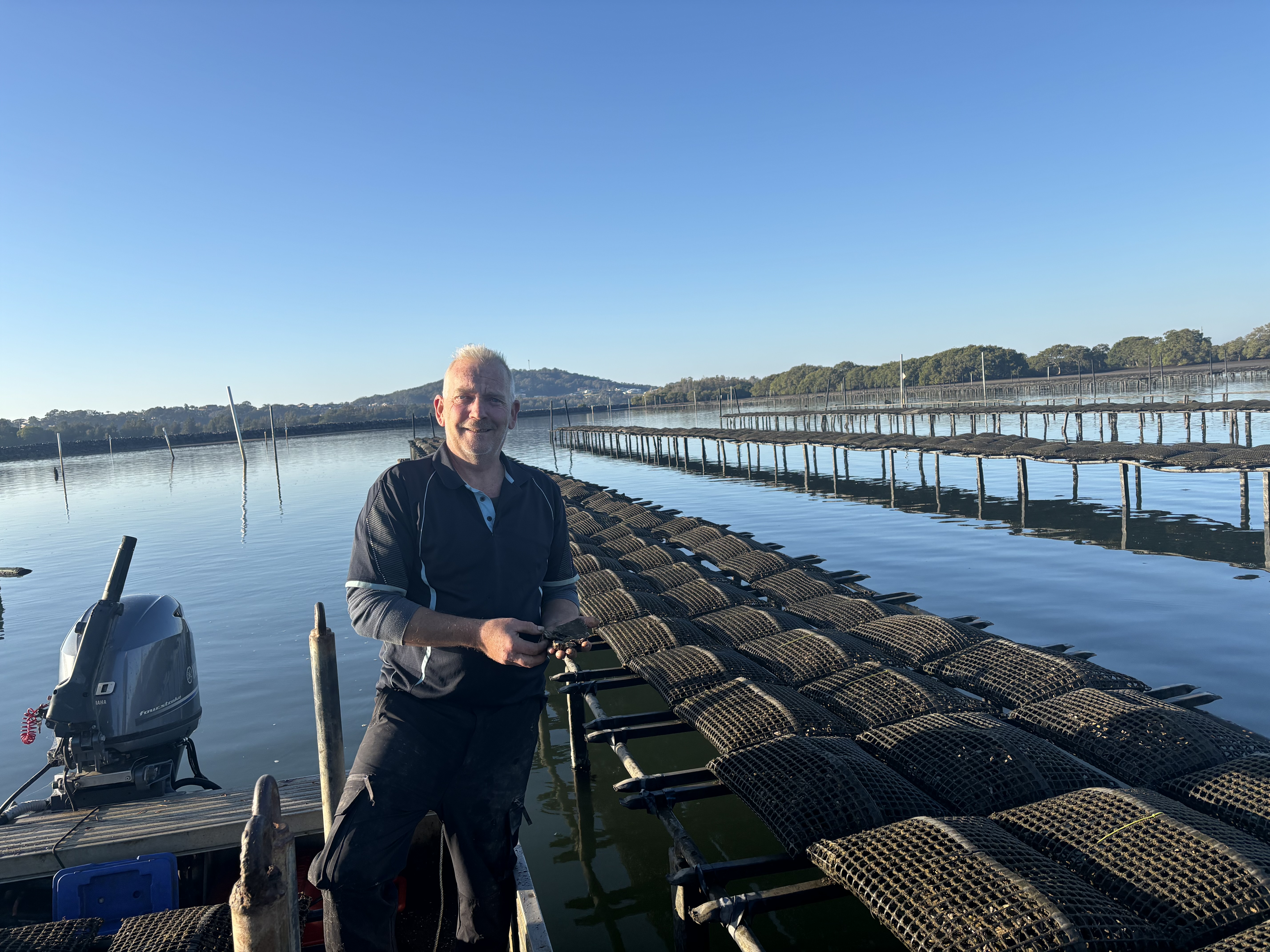 David Smith on his boat at the oyster lease, South West Rocks
